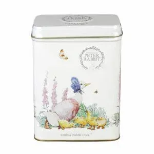The Beatrix Potter - 40 Teabag Tin features illustrations of Jemima Puddle-Duck, ducklings, flowers, and a butterfly on a white background under