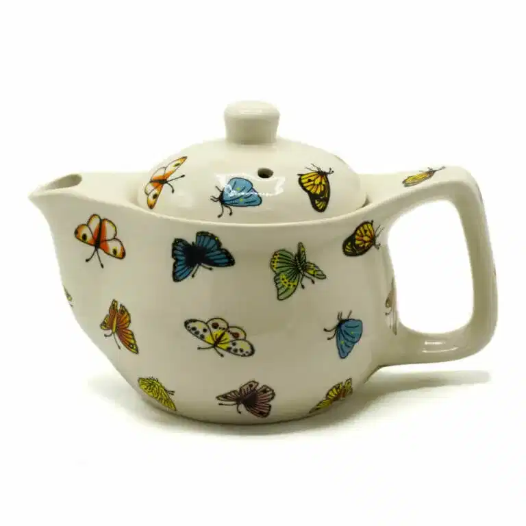 White ceramic teapot decorated with colorful butterfly illustrations on the body, lid, and handle.