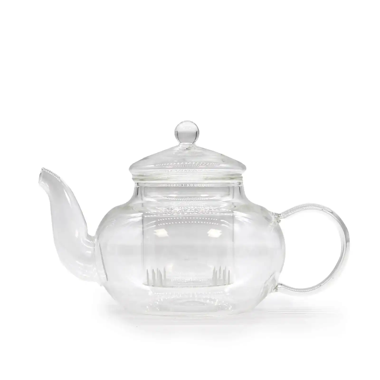 A clear glass teapot with a rounded body, a spout on the left, a curved handle on the right, and a lid with a round knob on top.