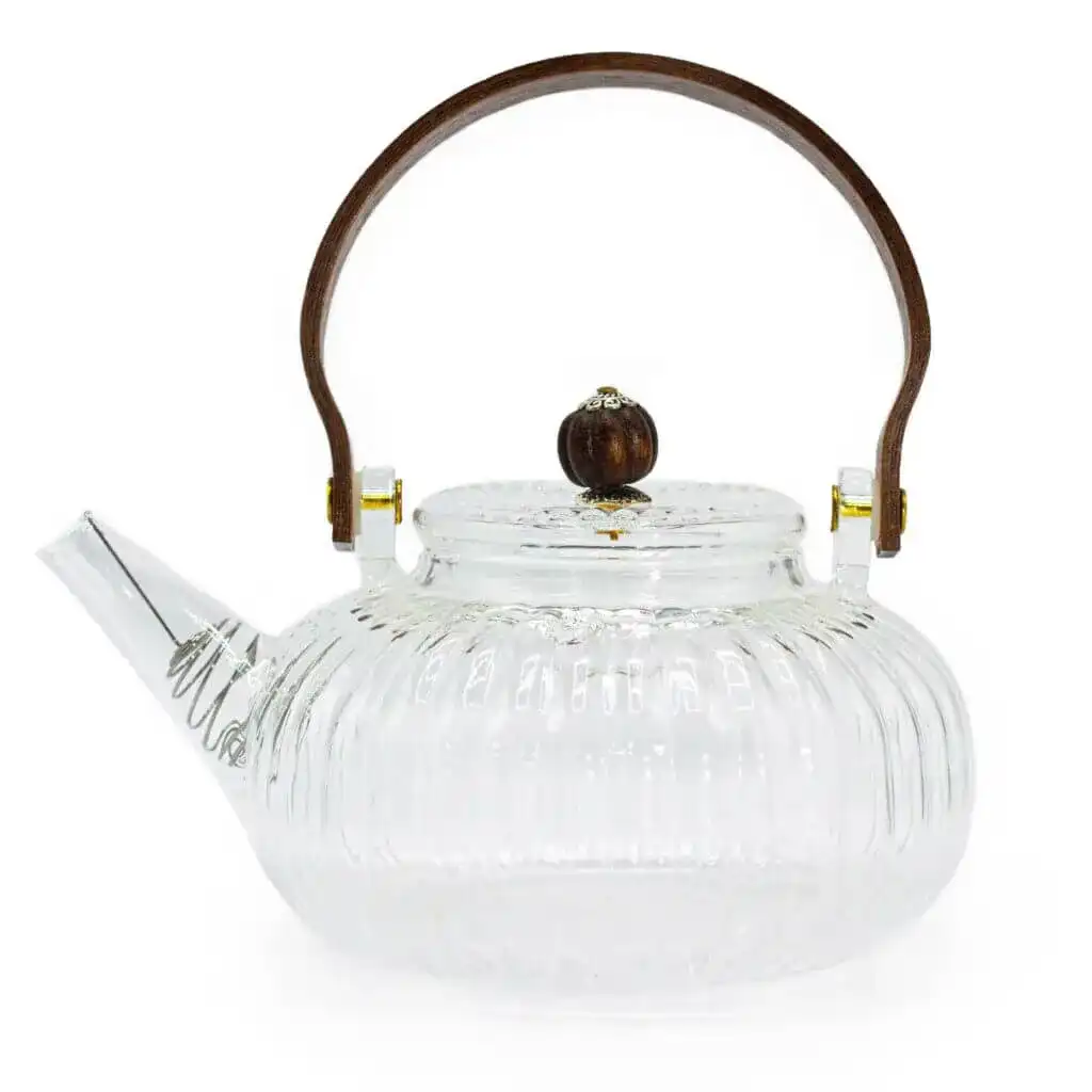Clear glass teapot with a ribbed design, short spout, round wooden handle, and matching wooden knob on the lid.