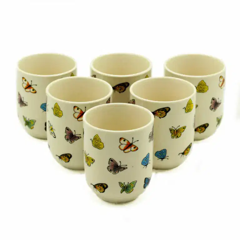 Six white ceramic cups are arranged in two rows, each decorated with colorful butterfly illustrations.