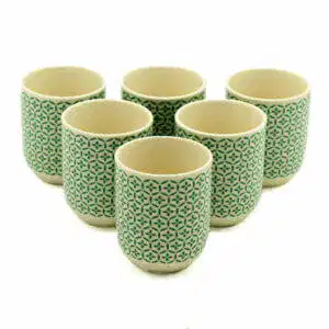 Six ceramic cups with a green geometric pattern are arranged in two rows on a white background.