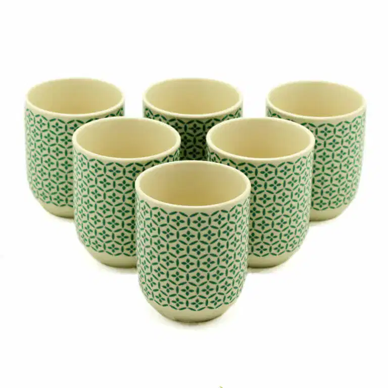 Six ceramic cups with a green geometric pattern are arranged in two rows on a white background.