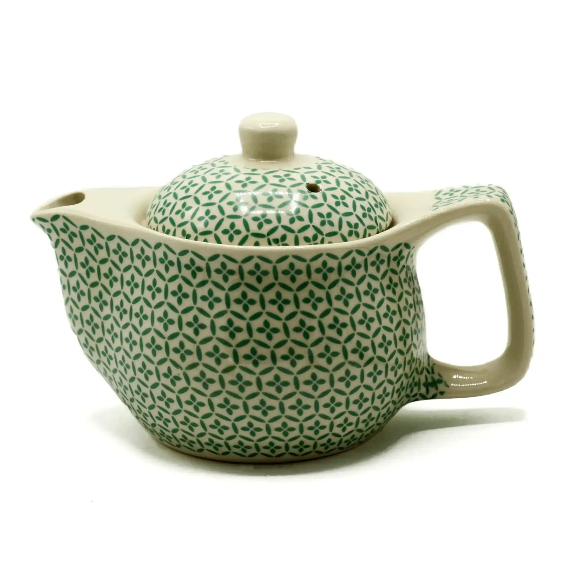 A ceramic teapot with a geometric green pattern and a large handle, shown against a white background.
