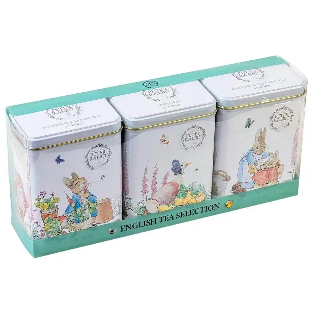 The Beatrix Potter Triple Tin Gift Pack features three Peter Rabbit-themed teabag tins with vibrant illustrations. They are presented in a rectangular green and white box labeled 