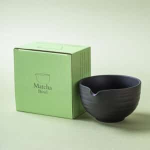 Matte black wheel-thrown stoneware matcha bowl (chawan) with throwing lines and pouring spout in giftbox hand-finished