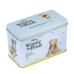 A charming tin featuring Winnie the Pooh illustrations, showcasing him savoring honey and swinging, adorned with 